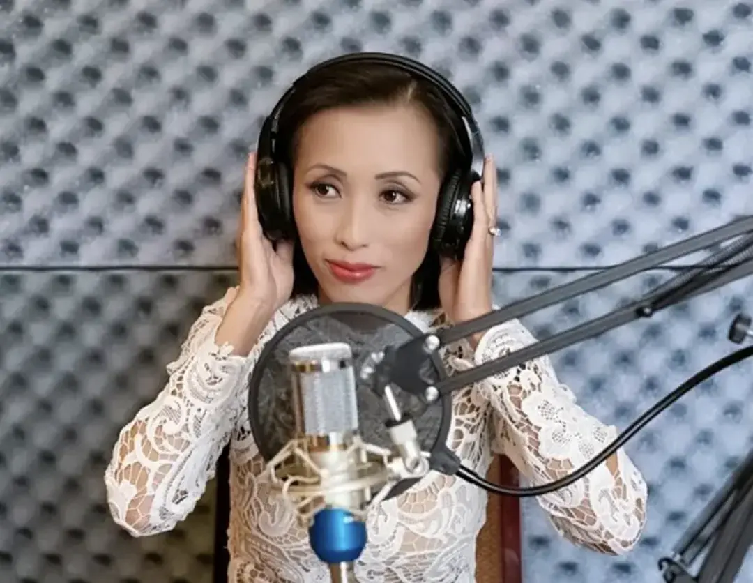 Emily in Radio Booth behind the Microphone